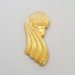 Goudkleurige broche vrouwenhoofd